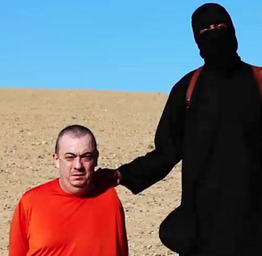 Džihád John na světové konferenci &quot;Stop předsudkům&quot;, kde se svým asistentem pronesl proslov na téma stereotypů vůči muslimům